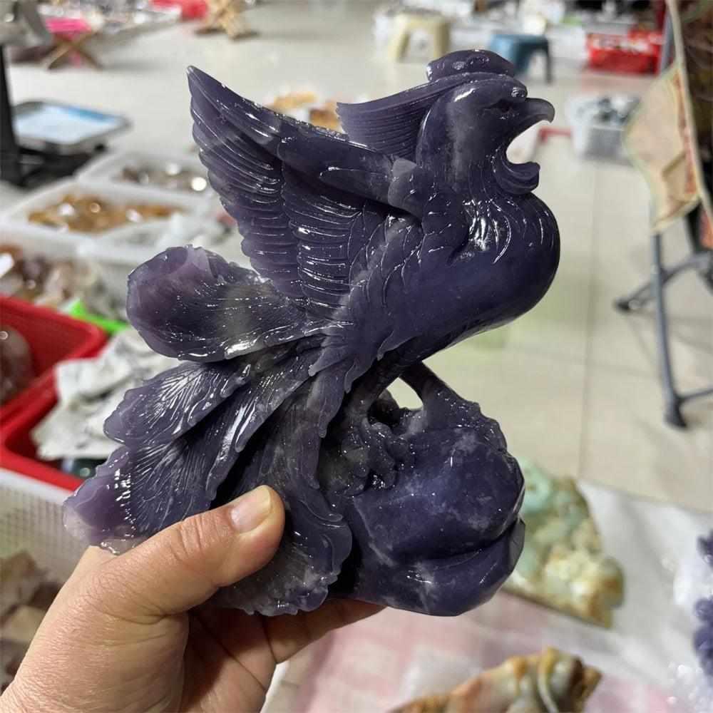 Natural Lepidolite crystal phoenix figurine with shimmering violet tones, intricate wing carvings, and spiritual energy.