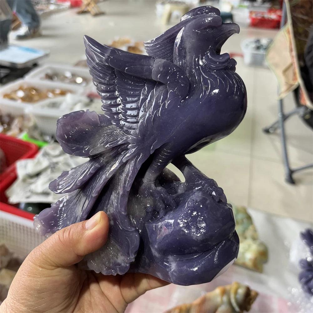 Hand-carved violet lepidolite phoenix figurine with shimmering layered detail for Crown and Third Eye chakra healing.