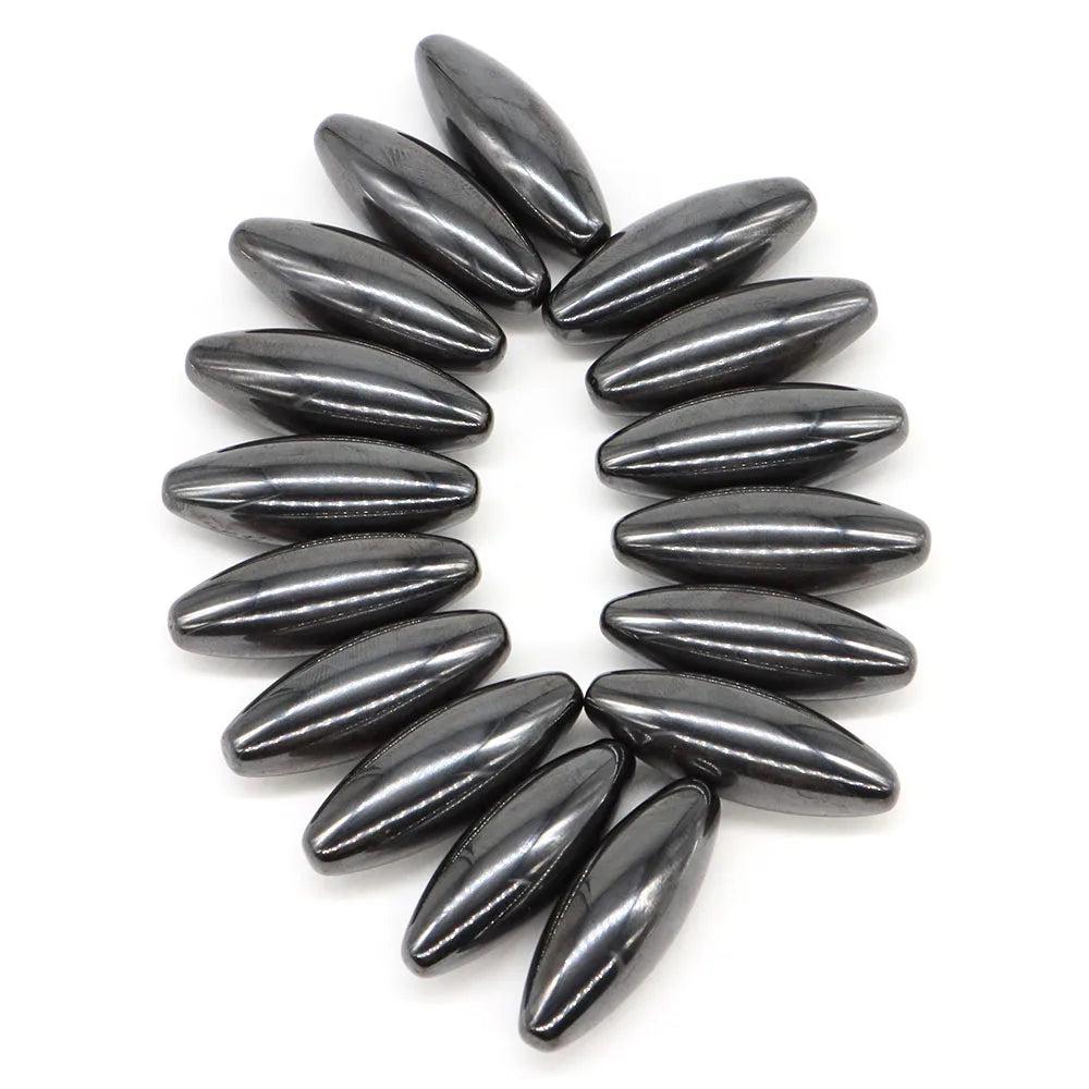 Polished, dark gray magnetic hematite olive-shaped beads (38x13mm) for grounding and stability.