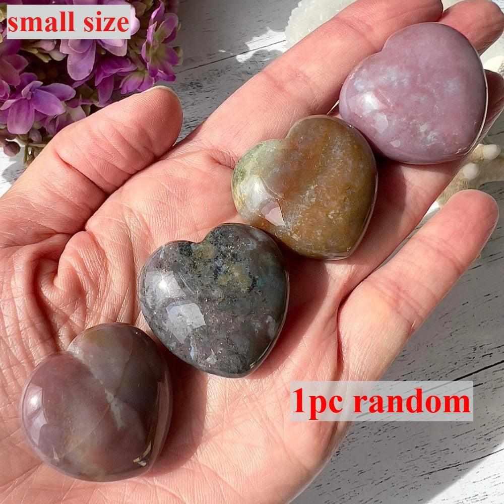 Small polished Ocean Jasper heart crystal with unique orb patterns in green, pink, and tan for emotional healing.