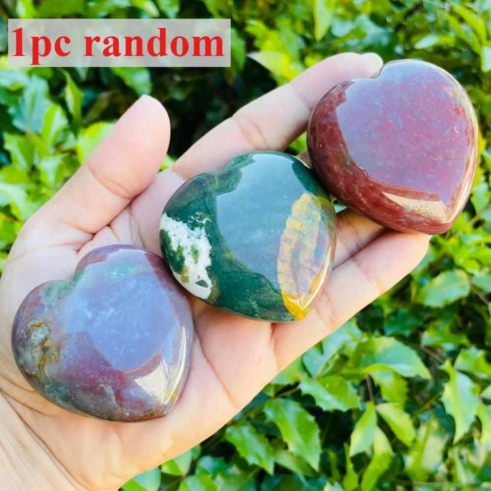 Polished Ocean Jasper heart crystal with vibrant orb patterns in green, tan, and pink for heart chakra healing and joy.
