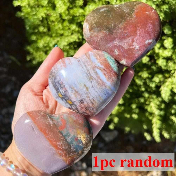 Polished Ocean Jasper heart crystal with orb patterns in green, pink, and tan for heart chakra healing and emotional joy.