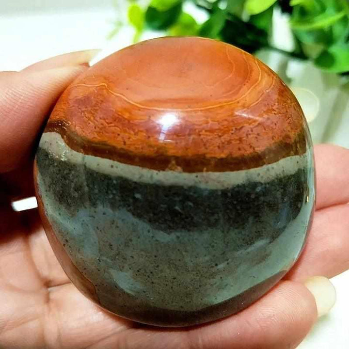 Polished Natural Polychrome Jasper palm stone with earthy rust, cream, and sage bands for grounding and meditation.
