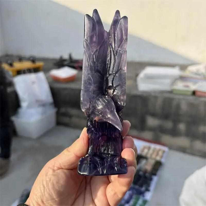 Natural purple fluorite eagle figurine with violet banding, perfect for Third Eye chakra clarity and spiritual vision.