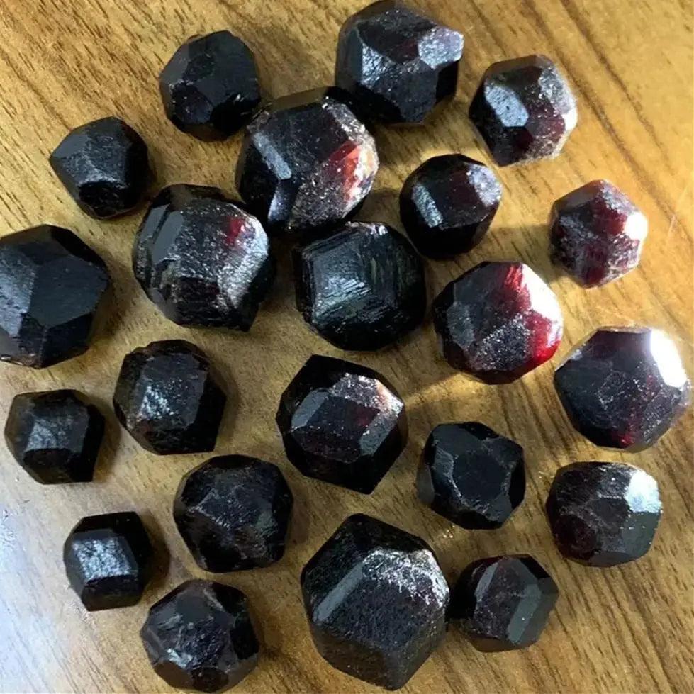 Rough natural red garnet crystal raw stones, varying in size, for healing and spiritual gifts.