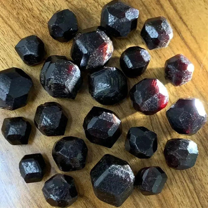 Rough natural red garnet crystal raw stones, varying in size, for healing and spiritual gifts.