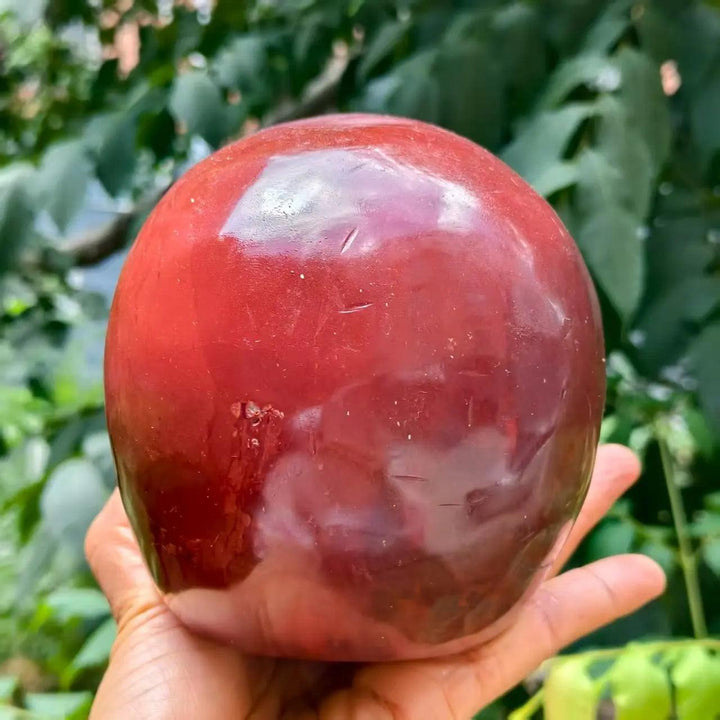 Hand-polished Natural Red Jasper skull crystal, a vibrant red healing stone for Reiki and spiritual decor.