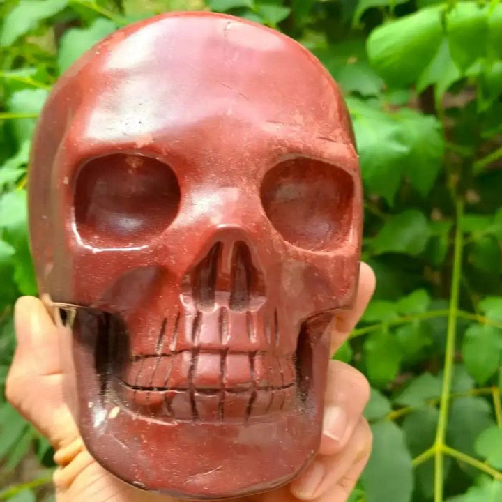 Hand-polished Natural Red Jasper skull, a smooth healing crystal carving with deep red tones for Reiki and home decor.
