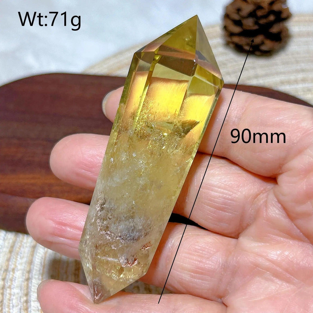 Natural smokey citrine double tower crystal, 90mm, held in hand.