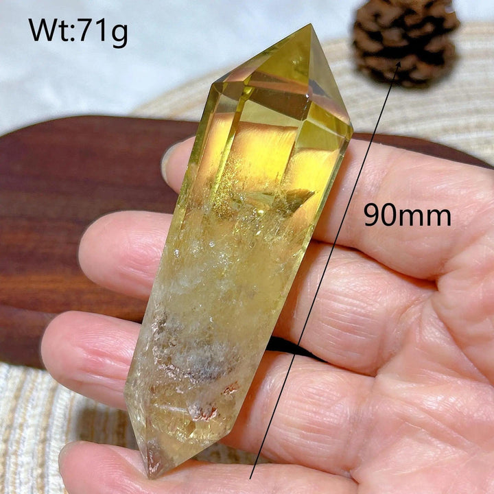 Natural smokey citrine double tower crystal, 90mm, held in hand.