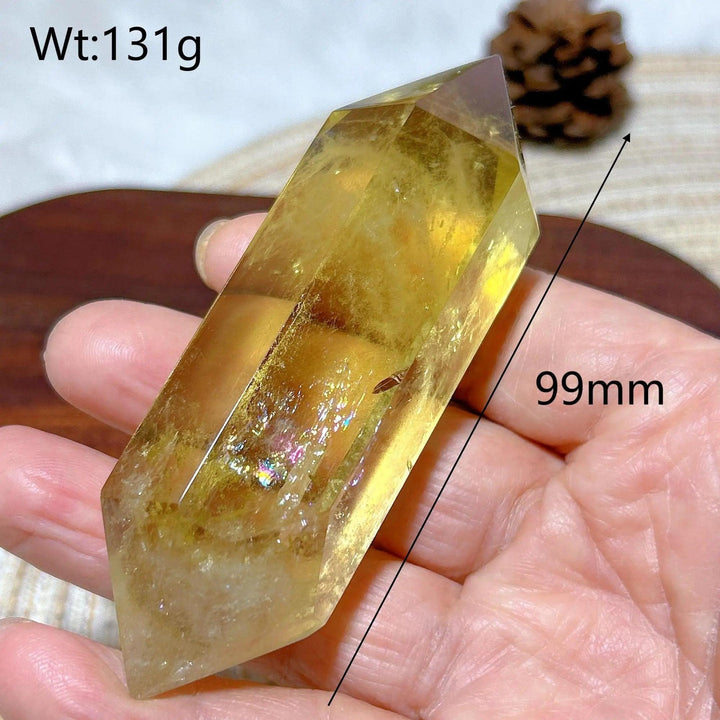 Natural yellow Citrine double tower crystal, 99mm long, held in hand.