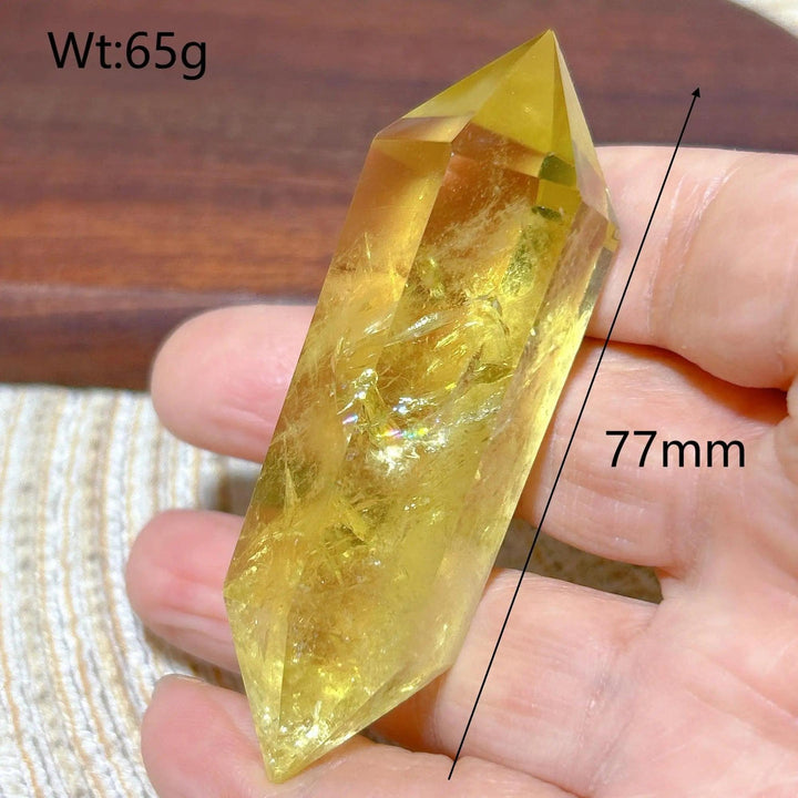 Natural yellow Citrine double tower crystal, 77mm long, held in hand. Ideal for Reiki and home decor.
