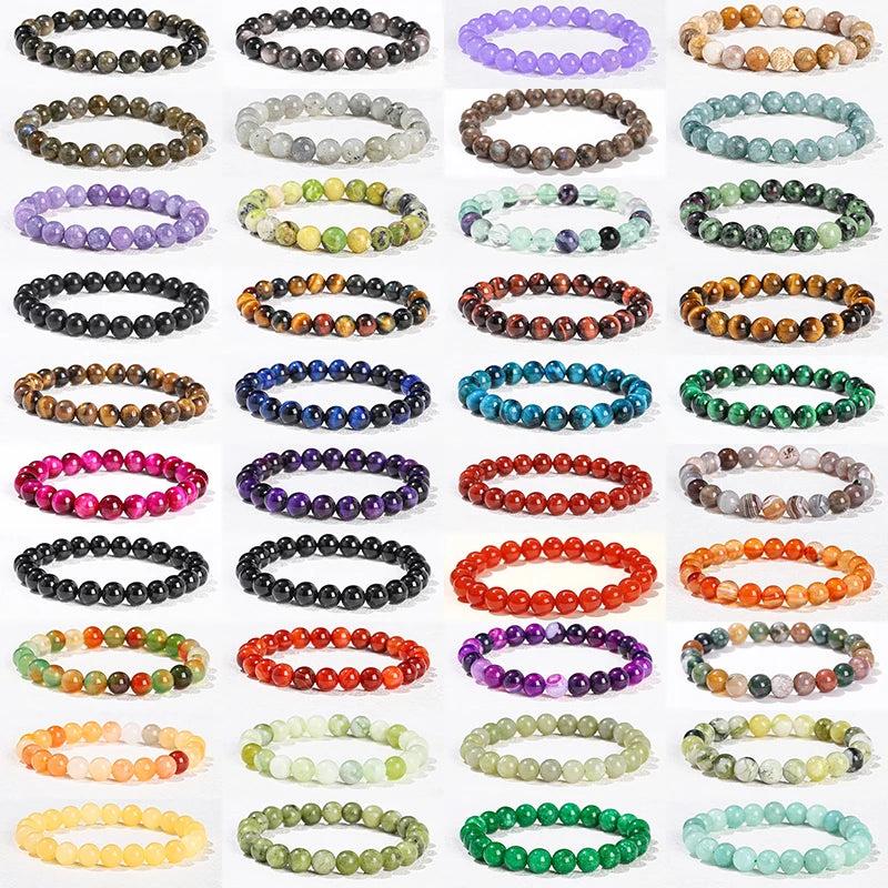 Collection of 30+ natural stone beaded bracelets in various colors, sizes, and healing crystals for a balanced lifestyle.