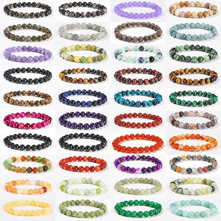 Collection of 30+ natural stone beaded bracelets in various colors, sizes, and healing crystals for a balanced lifestyle.