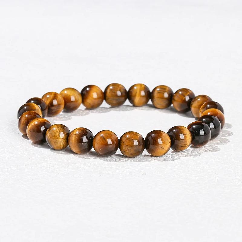 Natural stone Tiger’s Eye beaded bracelet with smooth, golden-brown elastic stretch design for grounding energy.