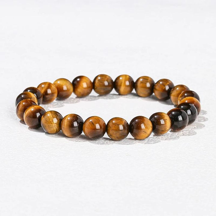 Natural stone Tiger’s Eye beaded bracelet with smooth, golden-brown elastic stretch design for grounding energy.