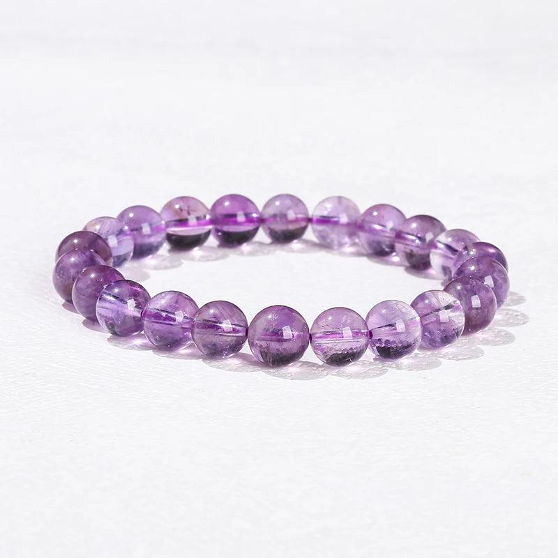 Smooth purple Amethyst beaded bracelet, a natural stone crystal design for healing and grounding on an elastic band.
