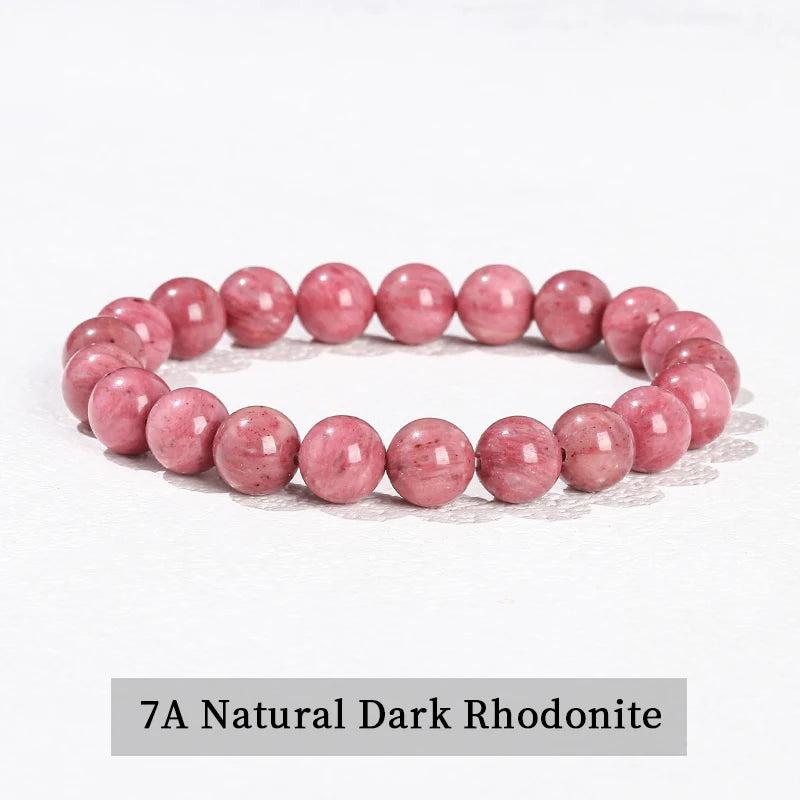 Natural Rhodonite beaded bracelet featuring smooth, pink gemstone spheres on a comfortable elastic stretch band.