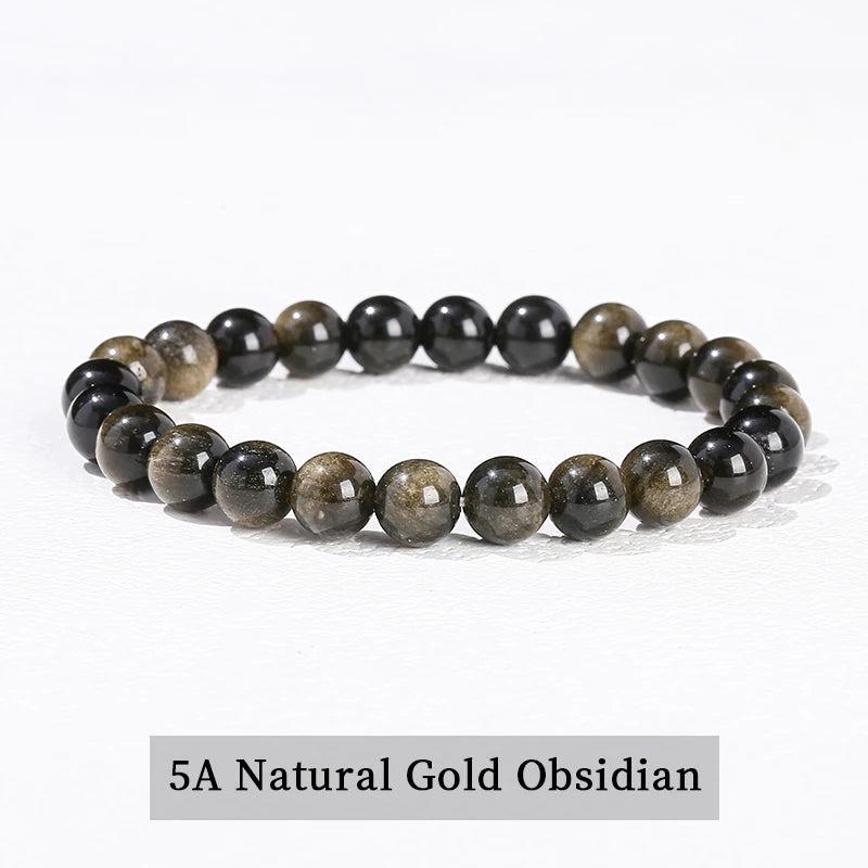 Natural Gold Obsidian beaded bracelet, a grounding stretch crystal accessory with shimmering black and gold tones.
