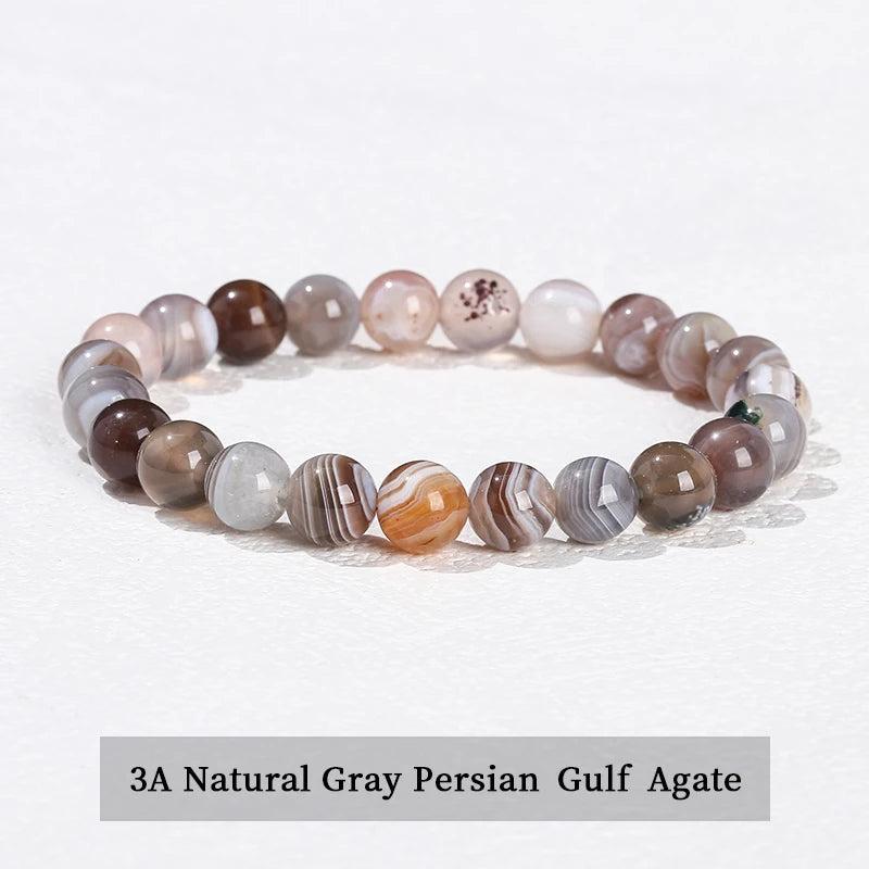 Natural stone beaded bracelet featuring smooth, banded gray Persian Gulf Agate beads on a comfortable elastic stretch band.