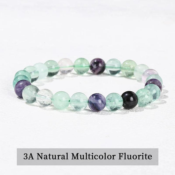 Multicolor Fluorite beaded bracelet with smooth, elastic design for chakra healing and natural energy.