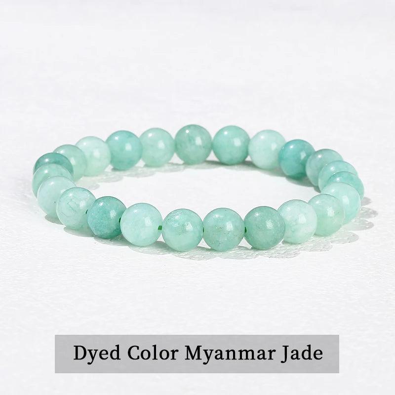 Natural stone beaded bracelet in dyed Myanmar jade, featuring smooth, light green elastic beads for healing energy.
