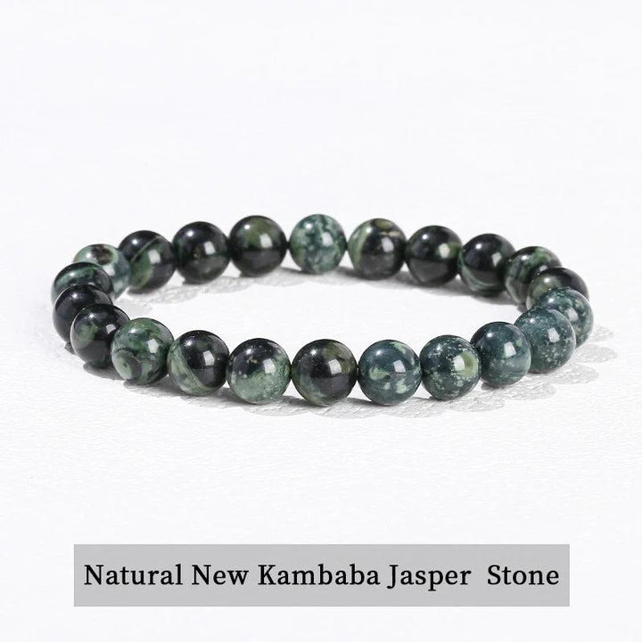 Natural Kambaba Jasper beaded bracelet, a grounding stretch crystal accessory with smooth, dark green patterned stones.