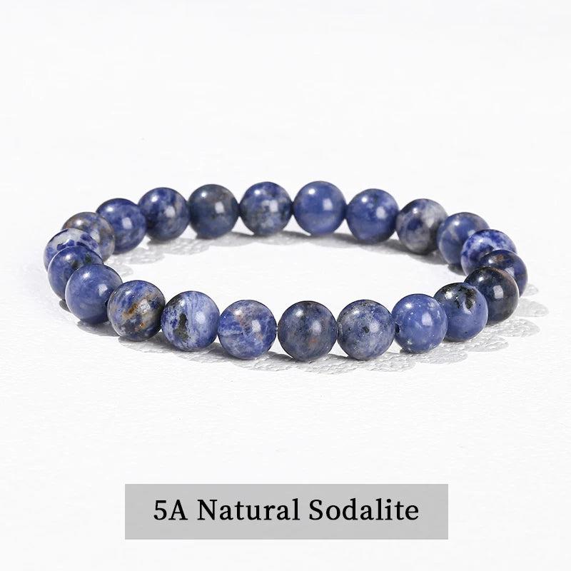 Natural Sodalite beaded bracelet, a grounding crystal stretch accessory featuring smooth, deep blue gemstone spheres.
