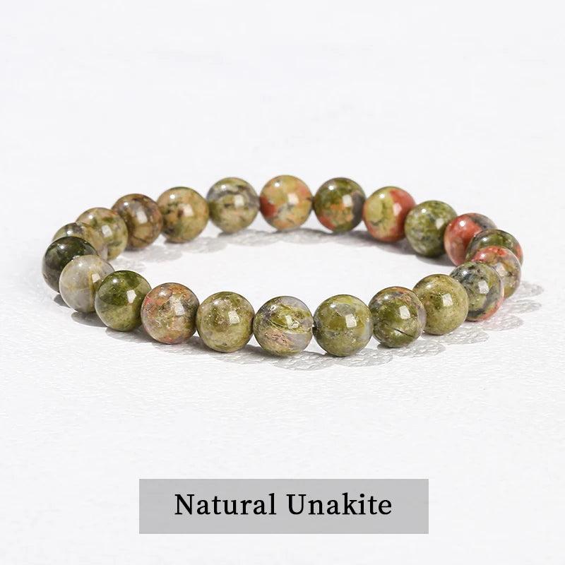 Natural Unakite beaded bracelet, a grounding stretch crystal accessory featuring smooth, earthy green and pink stone beads.
