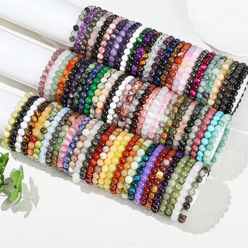 Natural stone beaded bracelets in 30+ crystal varieties featuring smooth, elastic gemstone beads for healing energy.