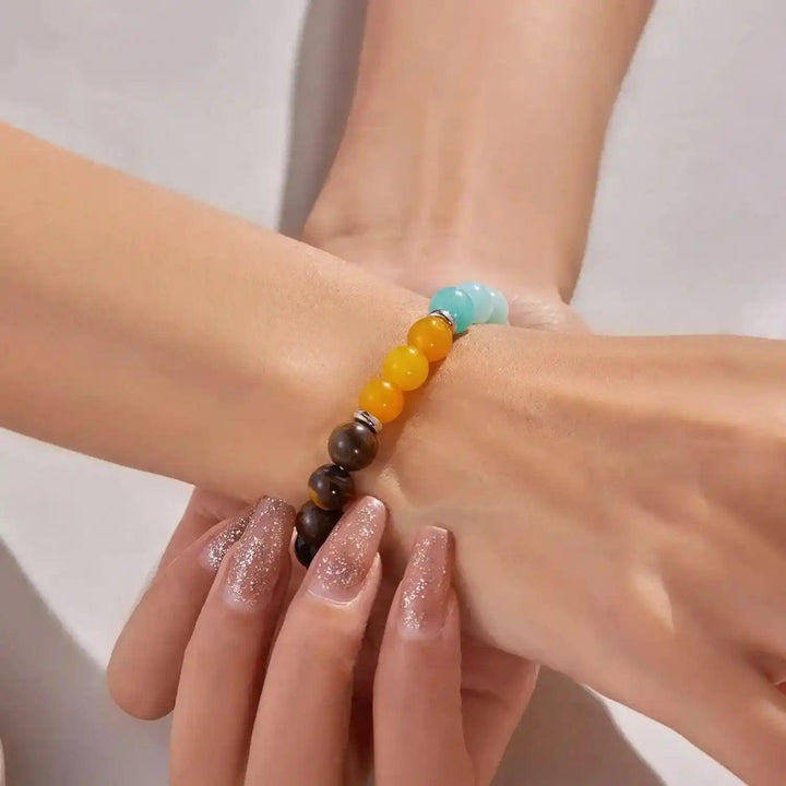 Handcrafted Natural Stone Beaded Healing Bracelet with polished, multi-colored gemstones for grounding and well-being.