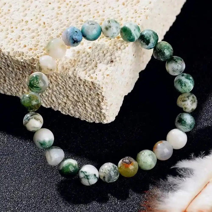 Natural Stone Beaded Healing Bracelet with polished green, white, and blue moss agate beads for grounding and balance.