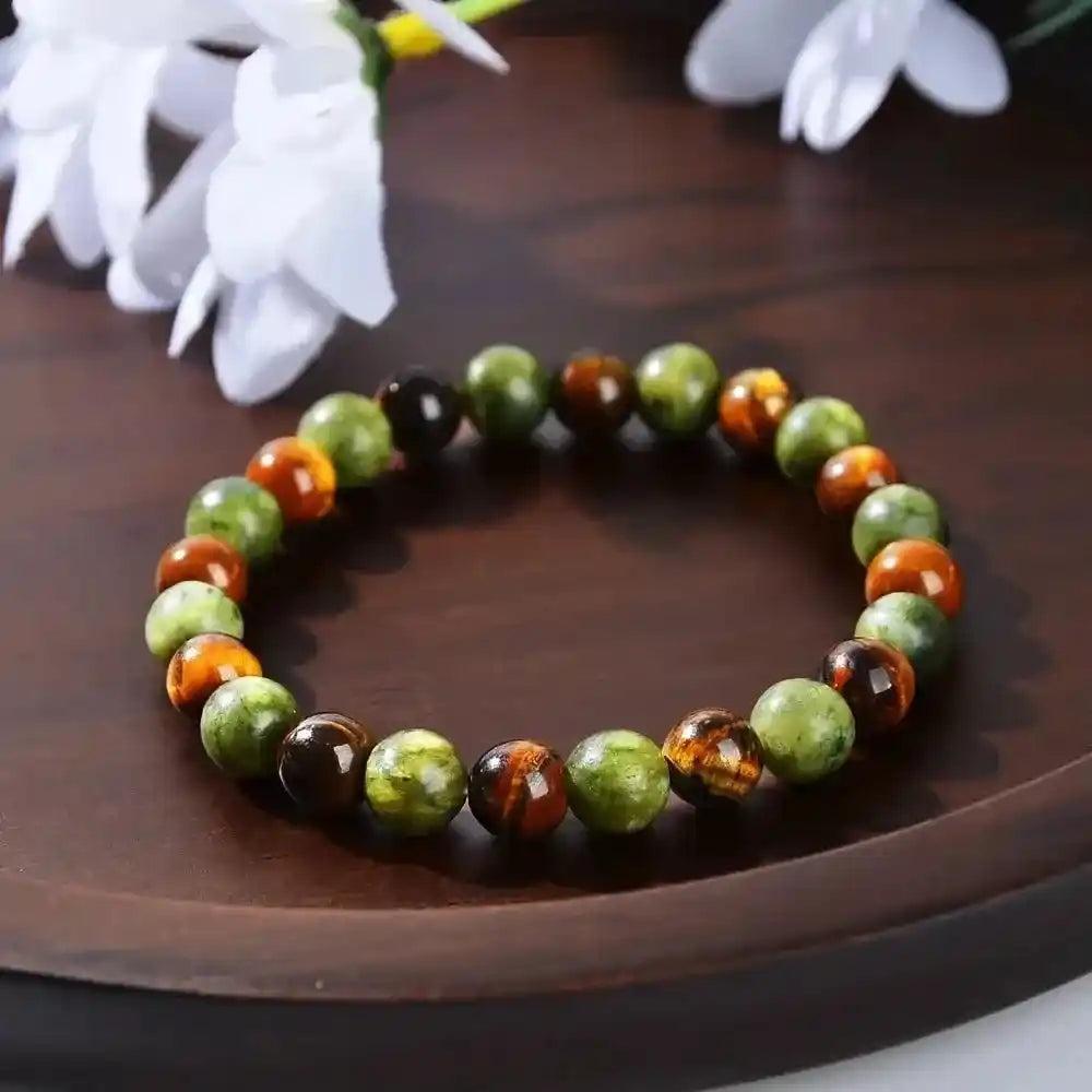 Natural Stone Beaded Healing Bracelet with polished green and tiger's eye gemstones for grounding and protection.