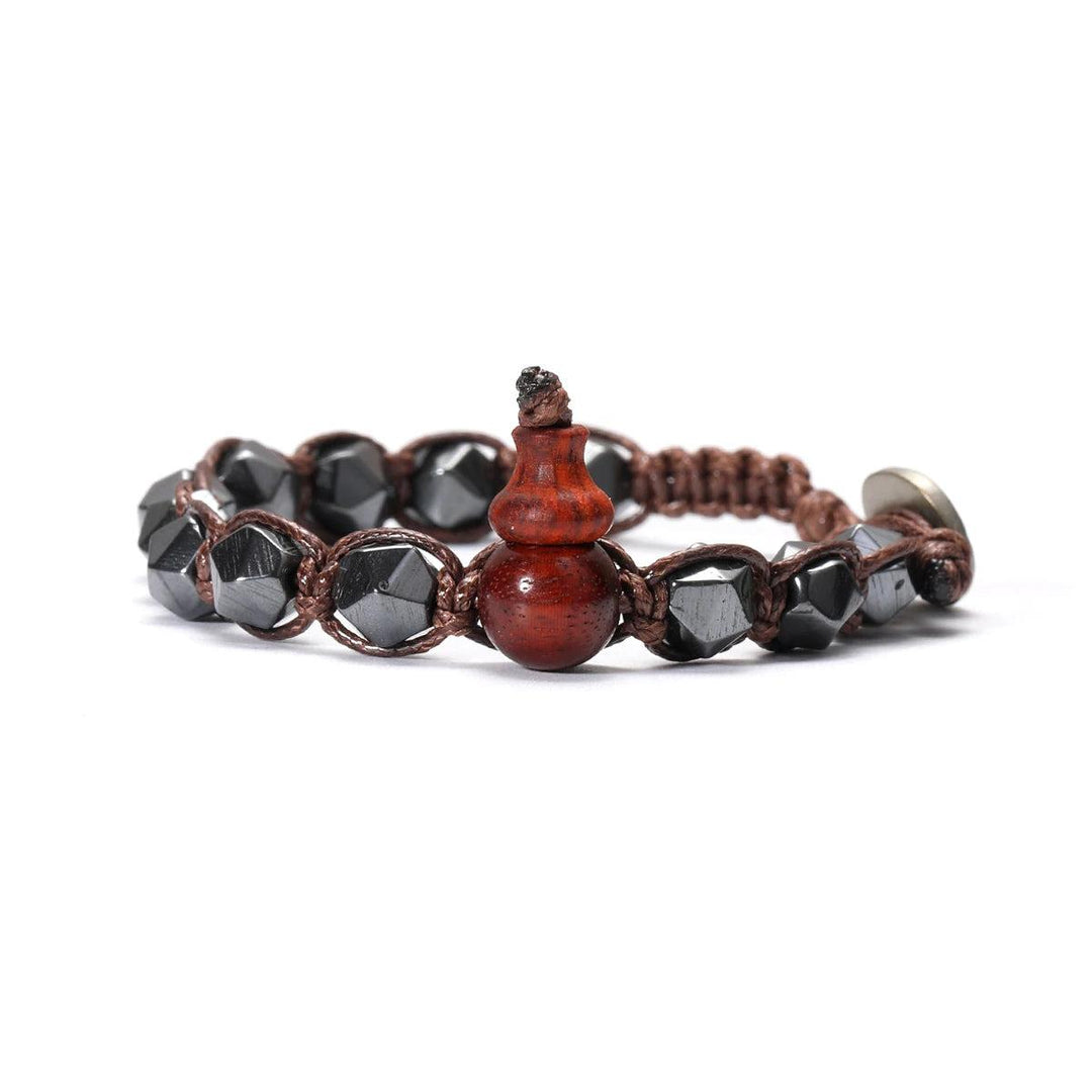 Natural Stone Handwoven Adjustable Unisex Bracelet with dark hematite beads and a warm wooden gourd charm.