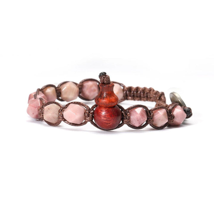 Pink natural stone handwoven adjustable unisex bracelet with a unique wooden gourd accent, promoting healing and love.