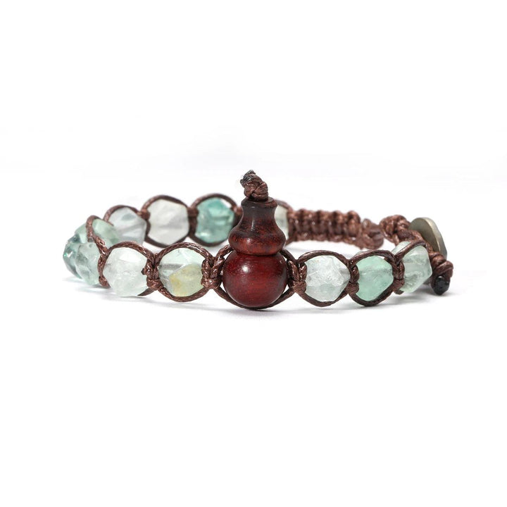 Natural Stone Handwoven Adjustable Unisex Bracelet with clear and green fluorite beads and a carved wooden gourd.