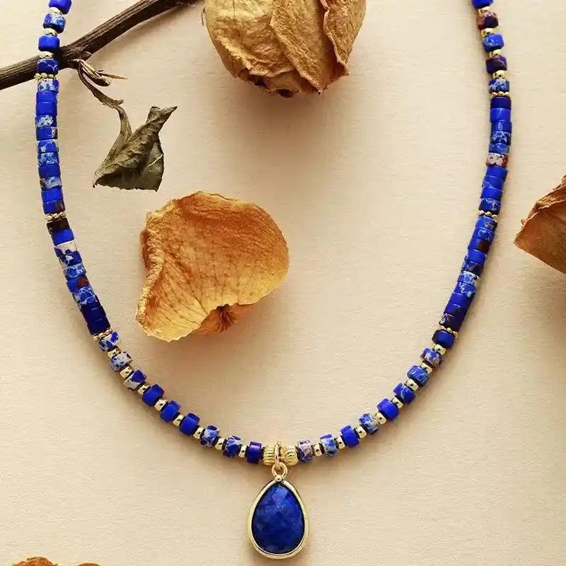 Crystal Destiny Lapis Lazuli teardrop choker necklace with blue gemstone beads, promoting wisdom and truth.