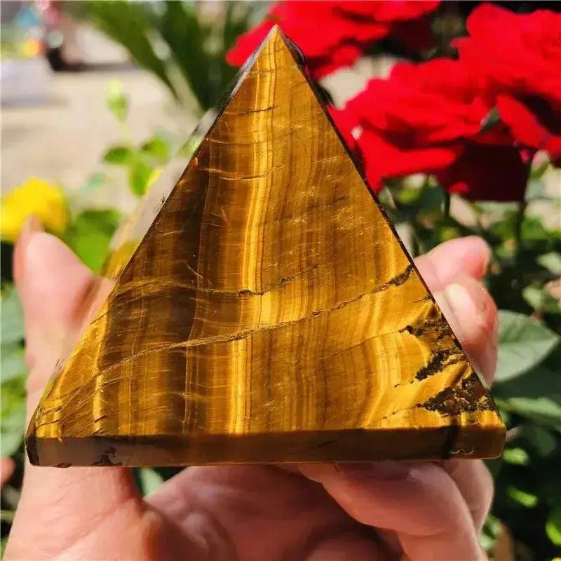 Polished golden-brown Tiger's Eye crystal pyramid from Crystal Destiny, showcasing unique chatoyancy and grounding energy.