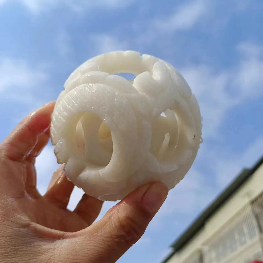 Hand-carved natural white jade exquisite ball, a polished quartz crystal sphere for Reiki healing, energy, and divination.