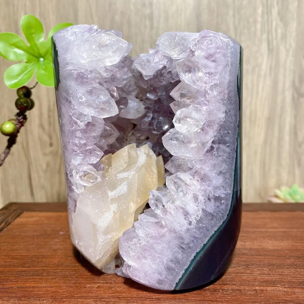 Raw amethyst geode with a central calcite crystal, a unique healing stone ornament for Feng Shui home decor.
