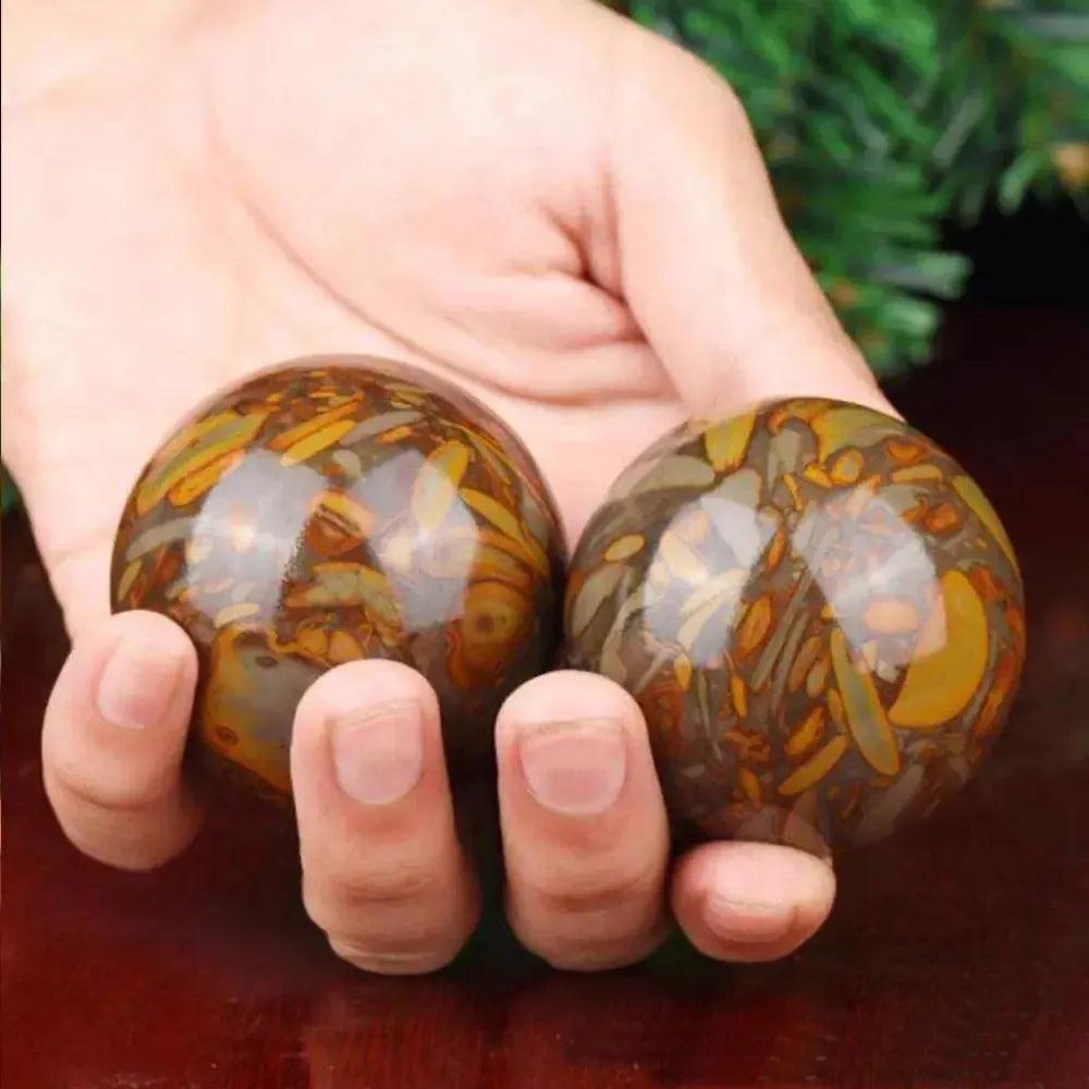 Polished Nuwa Stone Baoding Balls Pair, showcasing earthy patterns for stress relief and meditation.
