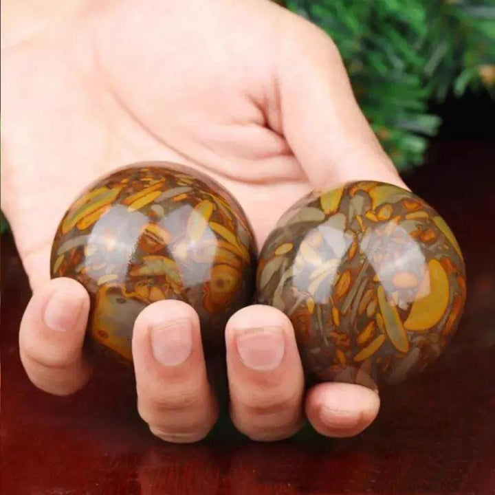 Polished Nuwa Stone Baoding Balls Pair, showcasing earthy patterns for stress relief and meditation.