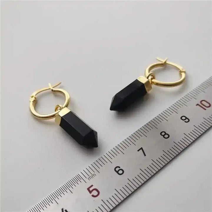 Crystal Destiny's black obsidian point dangle earrings with gold-plated hoops, shown with a ruler for size.
