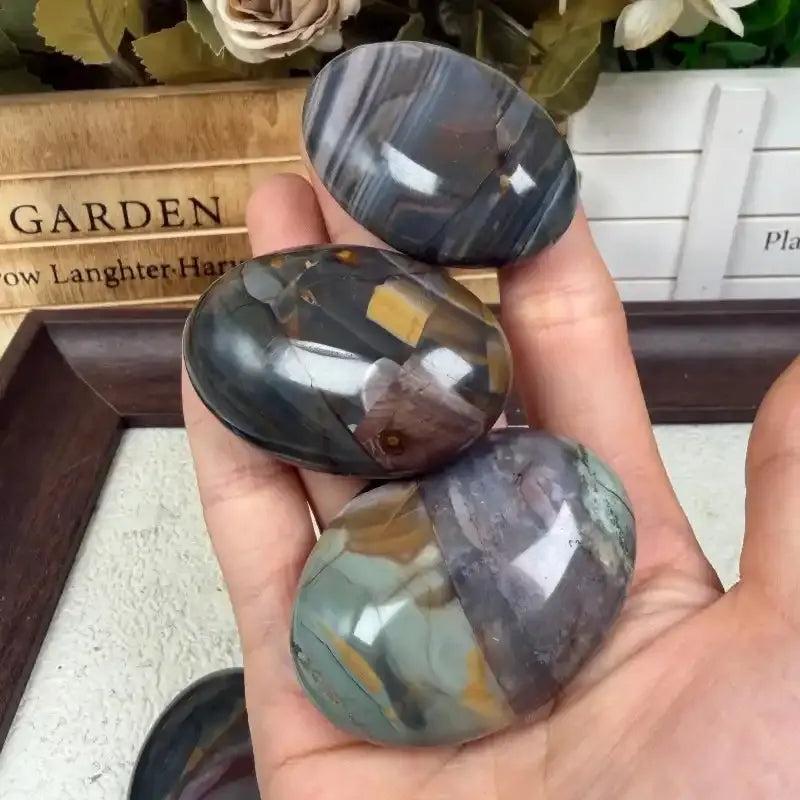 Polished Natural Ocean Banded Agate palm stones with unique, calming earth-tone veins for healing and home decor.
