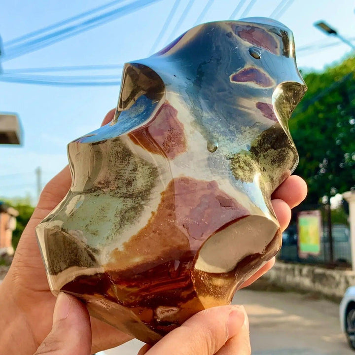 Polished Ocean Jasper flame freeform, showcasing its unique orbicular patterns in green, pink, cream, and red.