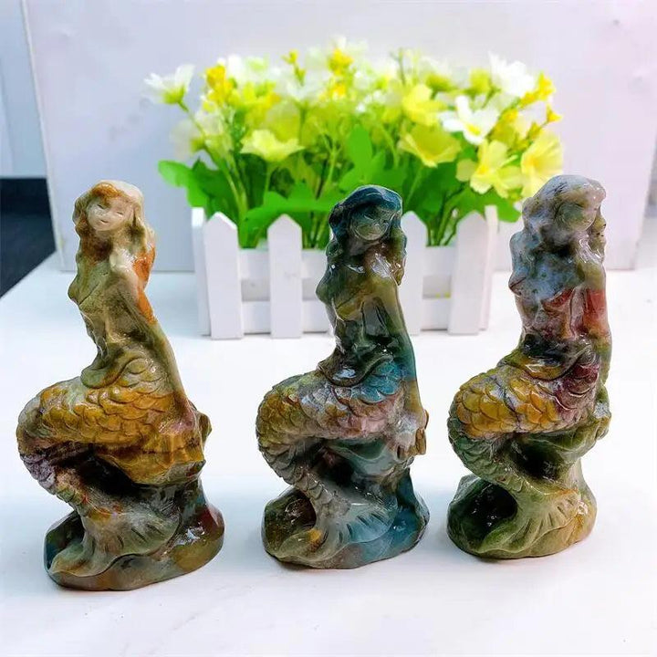 Three 115mm ocean jasper mermaid statues in swirling greens, creams, and pinks, embodying ocean energy.