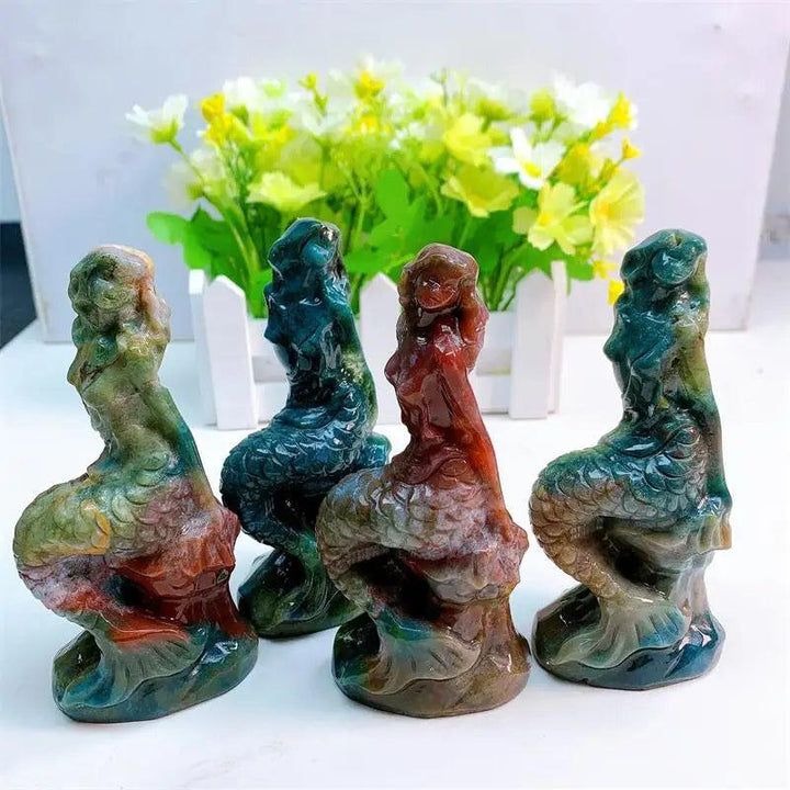 Four 115mm ocean jasper mermaid statues in swirling greens, creams, and soft pinks, symbolizing healing and peace.