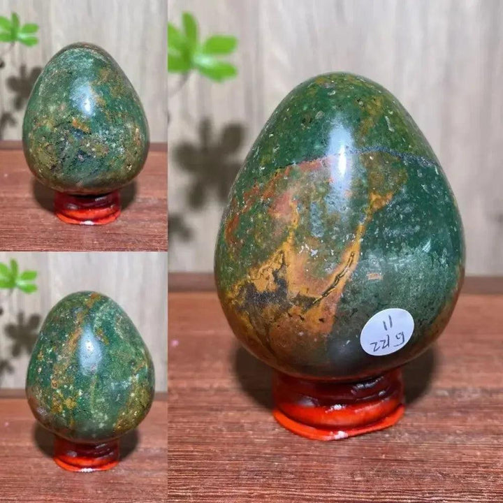 Ocean Jasper crystal egg from Crystal Destiny, featuring deep green, earthy brown, and peachy pink swirls.