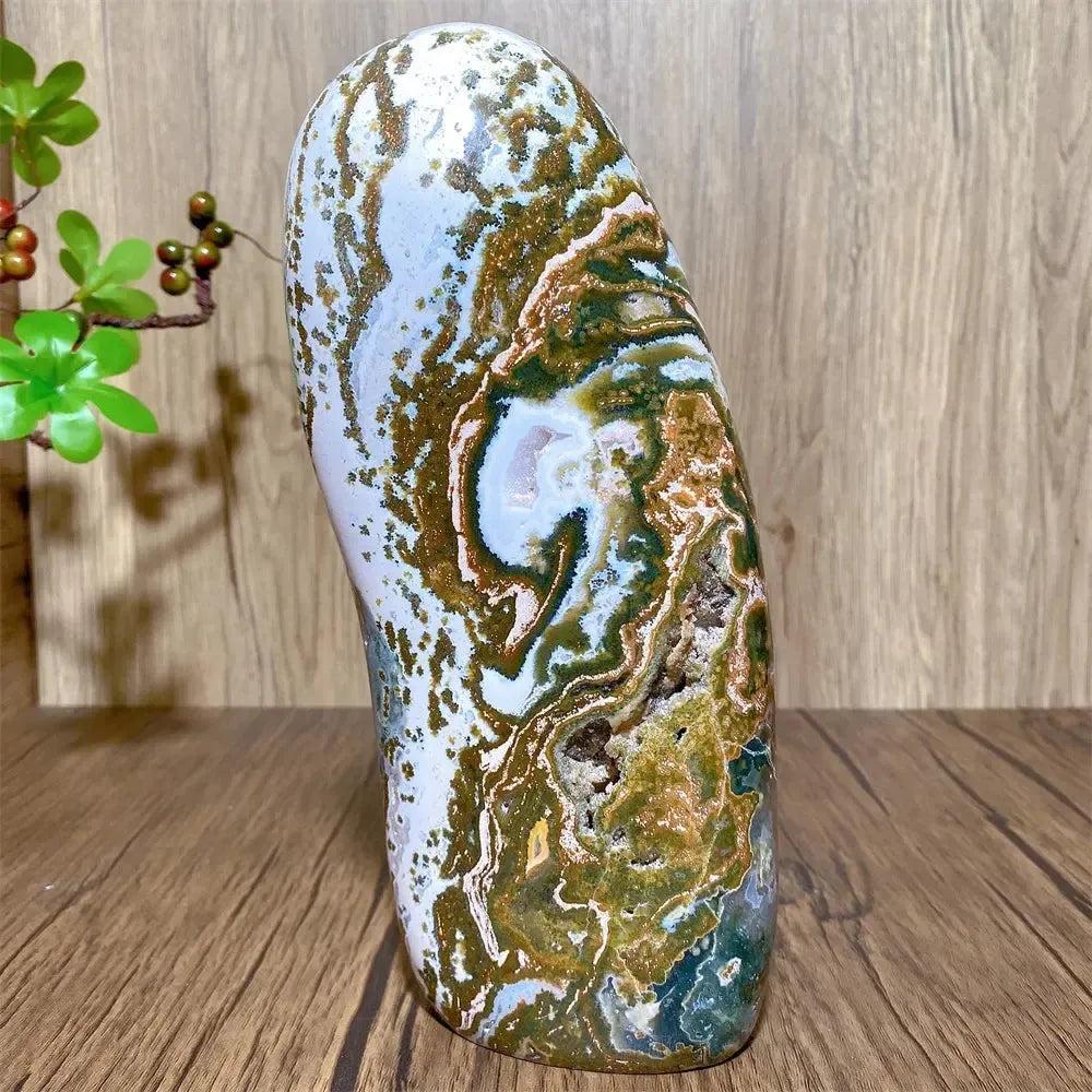Large Ocean Jasper Freeform Crystal with swirling orbs, vivid greens, creams, pinks, and earthy tones.