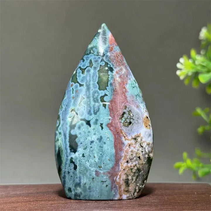 Ocean Jasper crystal freeform orbicular stone, polished, with green, cream, rust, and blue patterns, druzy pockets.